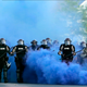 In this May 30, 2020, file photo, Minnesota State Police officers approach a crowd of protesters in Minneapolis. The Minnesota State Patrol purged e-mails and texts messages immediately after their response to protests in the wake of George Floyd’s death last summer, according to court testimony in a lawsuit that alleges the State Patrol targeted journalists during the unrest.